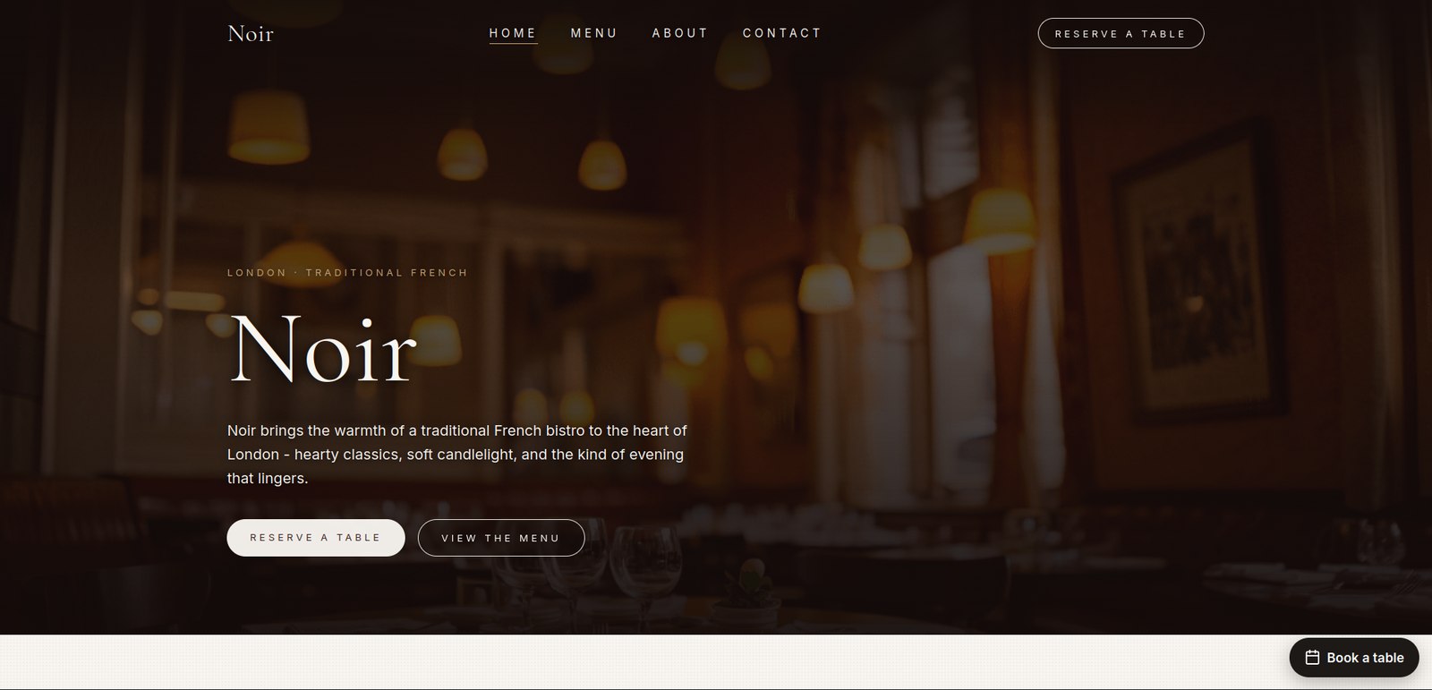 Noir, a French bistro in London, on a website built with The Main Course. A photograph of the candlelit dining room fills the page behind the restaurant's name, with buttons to reserve a table and view the menu, and a booking bubble in the bottom corner.